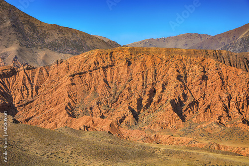 Beautiful view of cliffs from yellow red limestone. Kyrgyzstan.