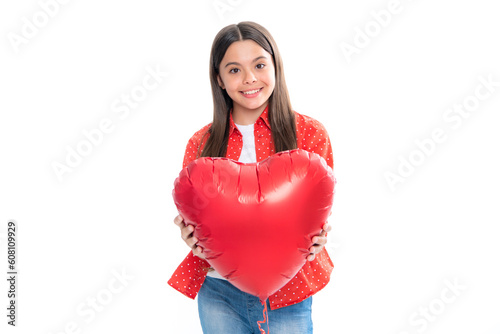 Cheerful lovely romantic teen girl hold red heart symbol of love for valentines day isolated on white background. Portrait of happy smiling teenage child girl. © Olena