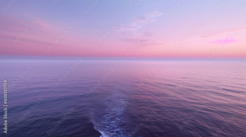 Dawn breaking over the ocean in the wake of a boat