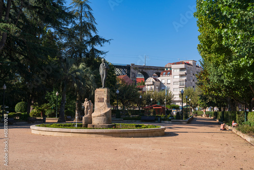 Redondela town hall square where you can see a beautiful statue and the train tracks in the background. Photograph made in Pontevedra, Galicia, Spain