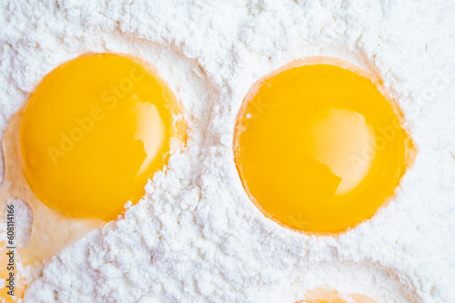 Egg yolk in flour isolated on white background. Macro shot