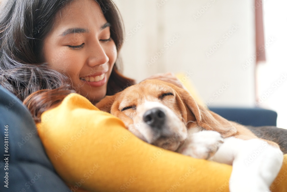Furry friends. Embracing the pet. Woman with pug dog is at home at daytime