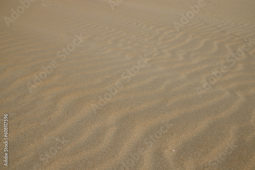 Waves of sand on the seashore. Selective focus. Close up. Background