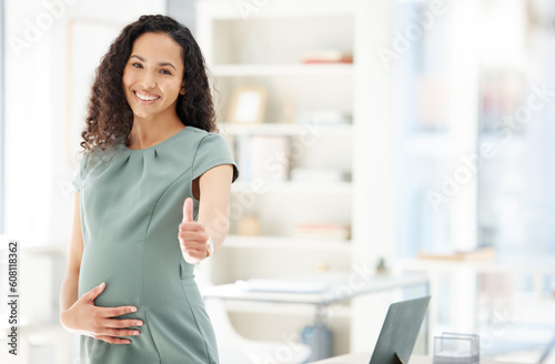 Portrait  thumbs up and a pregnant business woman in her office getting ready for maternity leave from work. Happy  mother or support with a young female employee holding her stomach in the workplace
