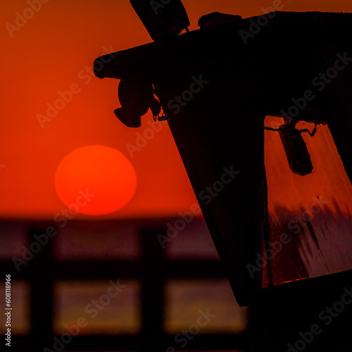 SUNSET BY THE SEA - The evening sun is hiding behind horizon
 photo