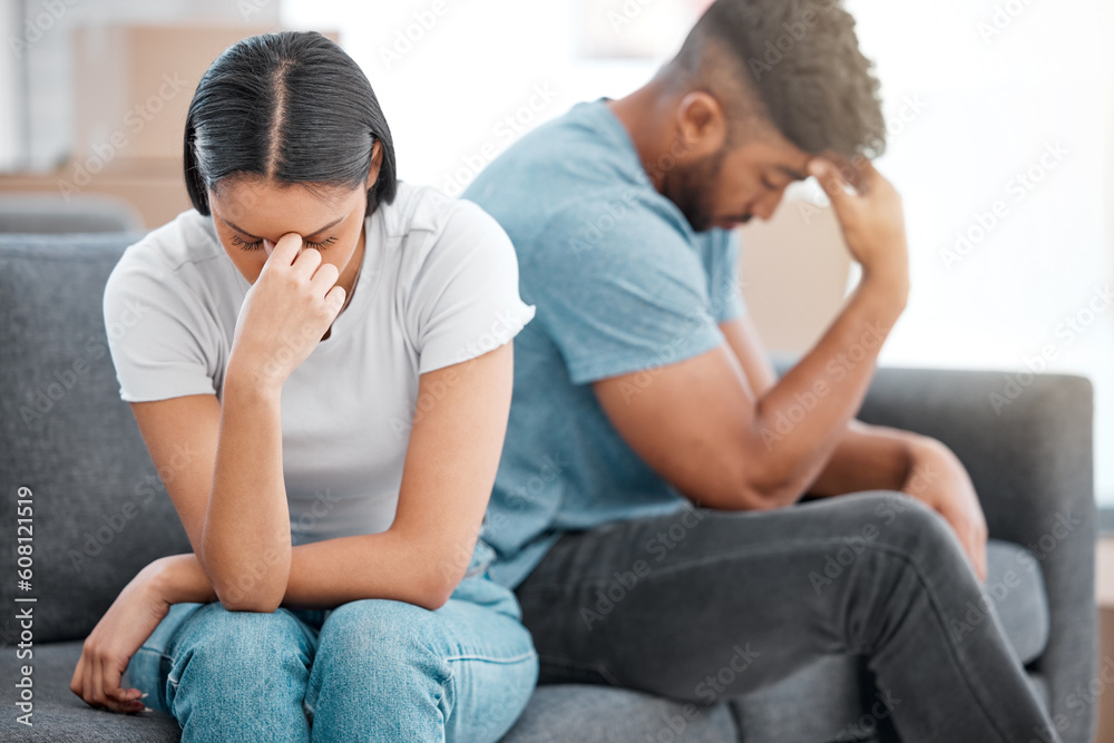 Couple, marriage fight and woman feeling sad and depressed on living room sofa with relationship problem. Divorce talk, cheating anxiety and crisis of young people on a lounge couch at home thinking Couple, marriage fight and woman feeling sad and depressed on living room sofa with relationship problem. Divorce talk, cheating anxiety and crisis of young people on a lounge couch at home thinking