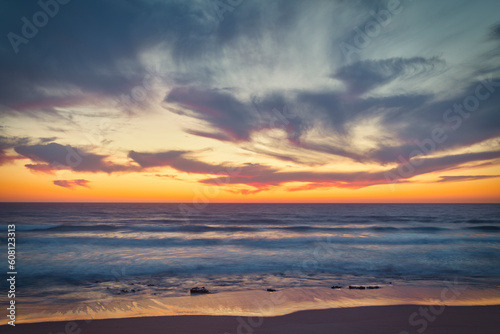 the moment after a beautiful sunset over a beach with pink clouds, Atlantic Ocean, Morocco, Tanger