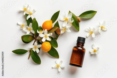 Neroli Essential Oil In Small Brown Bottle Next To Neroli On White Background, Top View. Generative AI photo