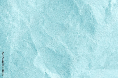 Wrinkled light blue paper as a background or wallpaper