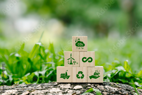 icon reduction of carbon emissions, carbon neutral, Net zero greenhouse gas emissions target, reducing carbon footprint concept, and CO2 emissions target on wooden cubes. circular economy concept