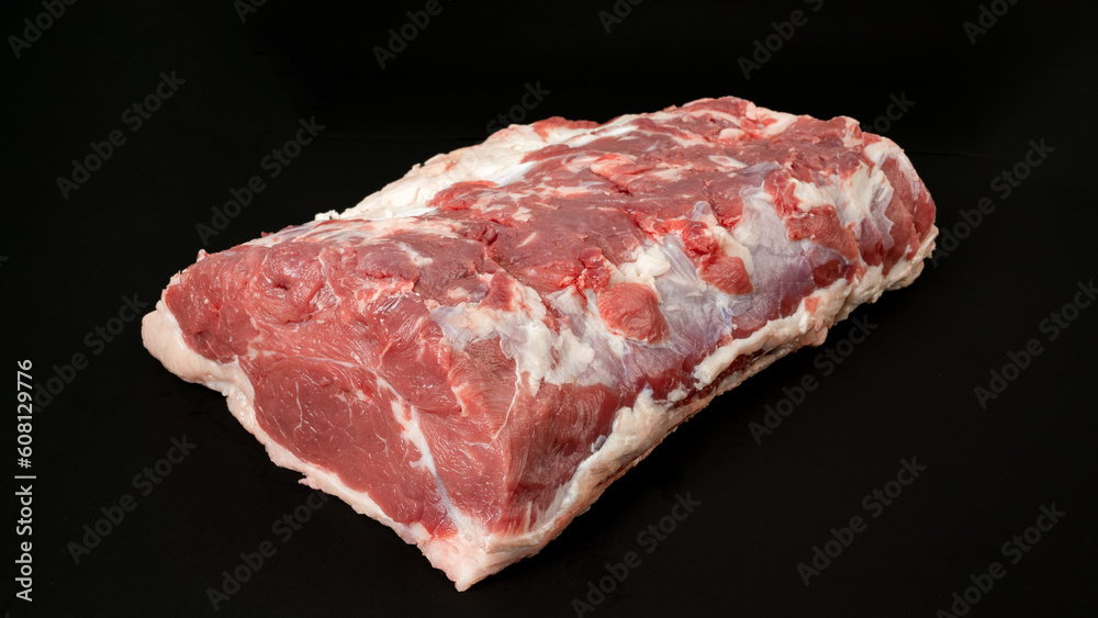 Cut of raw meat beef on black background