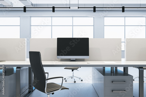 Modern concrete coworking office interior with panoramic windows and daylight, furniture and equipment, mock up place on computer screen. 3D Rendering. © Who is Danny