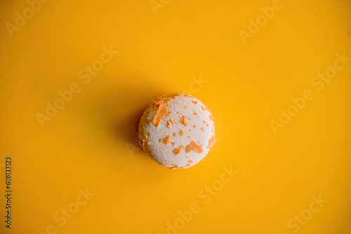 Crunchy Almond Brittle Macaroon on Vibrant Yellow Background
