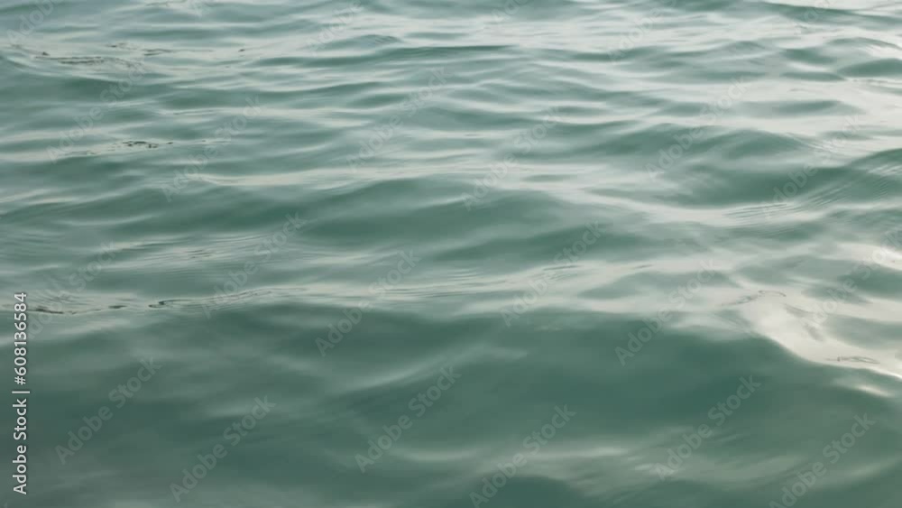 small waves and ripples on bacalar lagoon during sunrise, tight small waves and ripples on bacalar lagoon during sunrise, tight