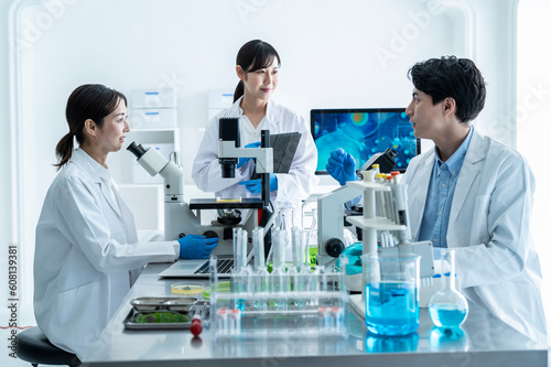 Scientists discussing progress in the laboratory
