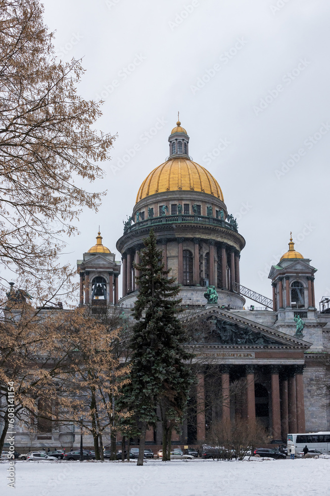 View of St. Isaac's Cathedral in the city of St. Petersburg, Russia. Architectural historical landmark of Saint Petersburg. Popular tourist attraction. Winter cityscape.