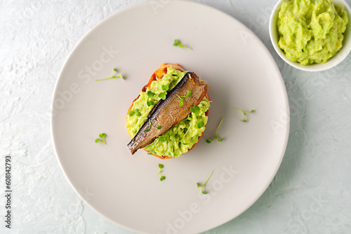 Fotografie Sandwiches with sprats on toasted slices of bread