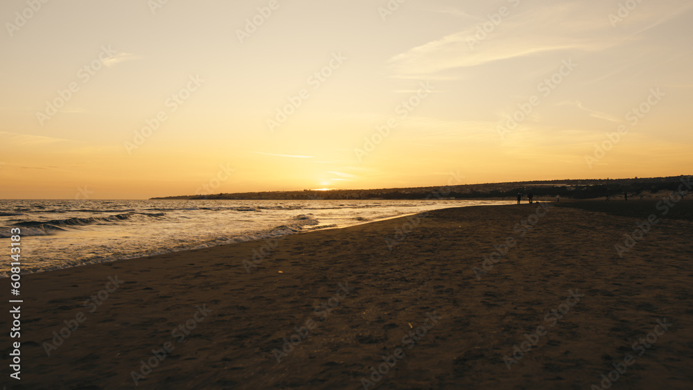 Walking on the summer empty beach at sunset sky Walking on the summer empty beach at sunset sky