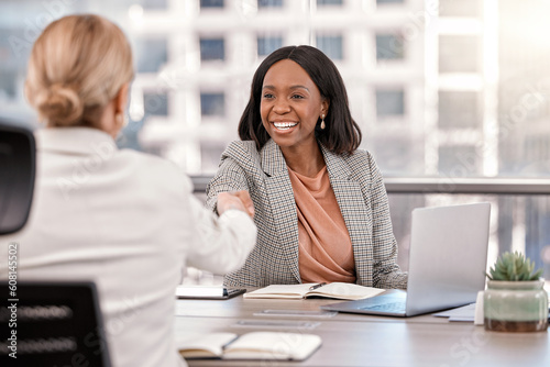Young, businesswoman and shake hands or meeting management or interview for new job and in the office. Partnership, human resource and female worker hired or success or team approved in the workplace