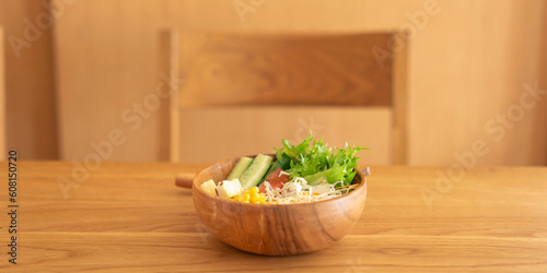 A salad on the dining table.                                              