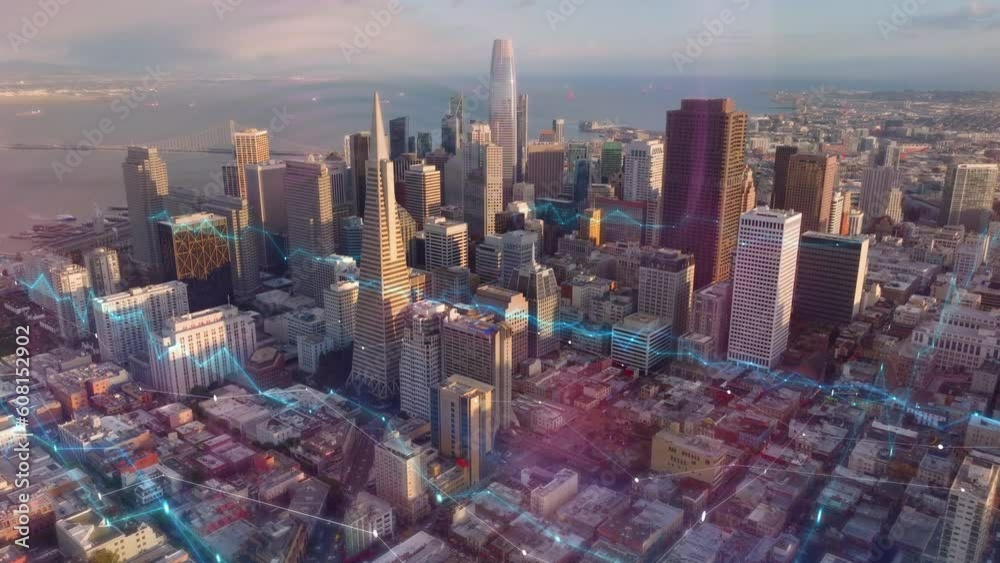 Group of business downtown skyscrapers lit by golden hour sunshine. Digital lines and charts, analysing collected data visual effects. San Francisco, California, USA