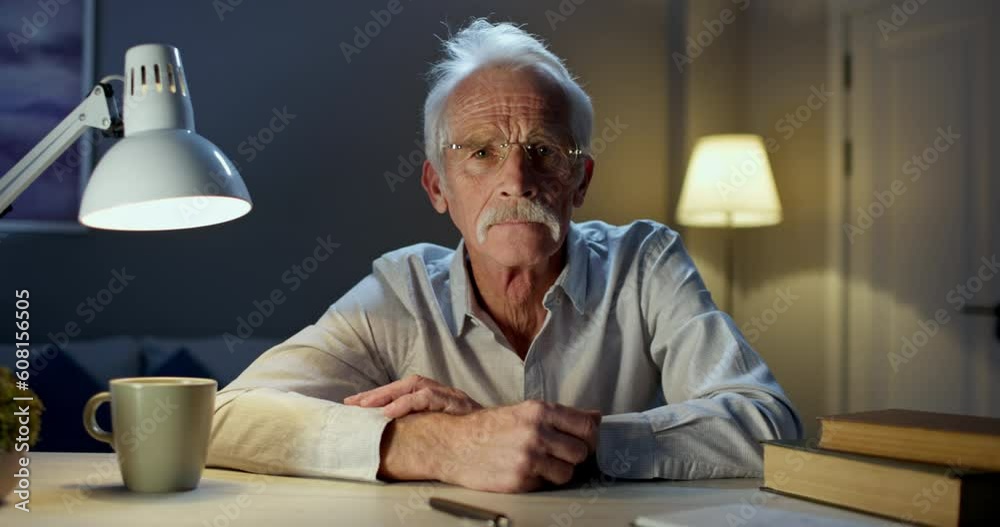 Online video call session with adult experienced psychotherapist who listens to complaints, problems. Old male psychotherapist with folded hands and wise look. Online video chat with psychotherapist Online video call session with adult experienced psychotherapist who listens to complaints, problems. Old male psychotherapist with folded hands and wise look. Online video chat with psychotherapist