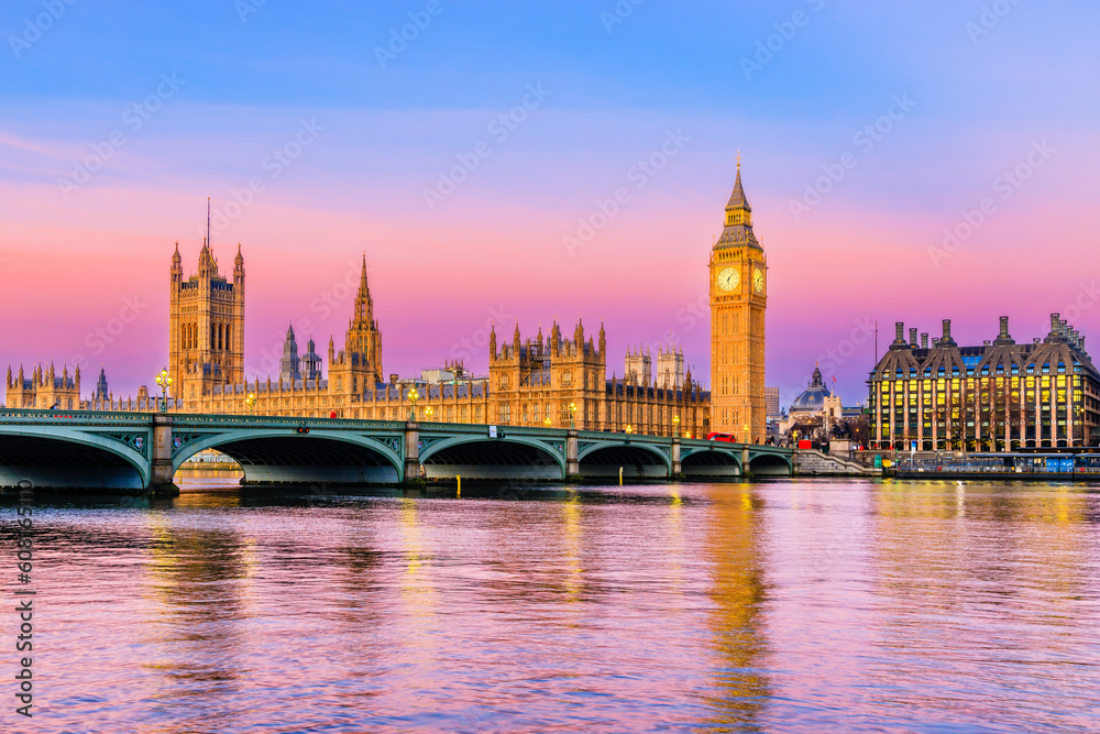 London, United Kingdom. The Palace of Westminster, Big Ben, and Westminster Bridge at sunrise.