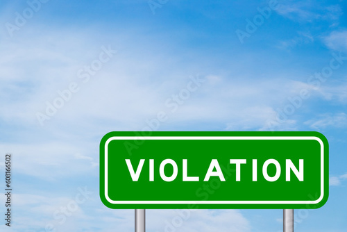 Green color transportation sign with word violation on blue sky with white cloud background photo