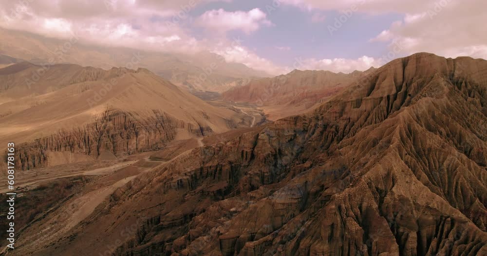 Drone captures the unique structured dry hills of Ghami, Upper Mustang, Nepal. Artistic mountains and hills create an alluring backdrop. Explore the enchanting beauty of Annapurna Area. Drone captures the unique structured dry hills of Ghami, Upper Mustang, Nepal. Artistic mountains and hills create an alluring backdrop. Explore the enchanting beauty of Annapurna Area.