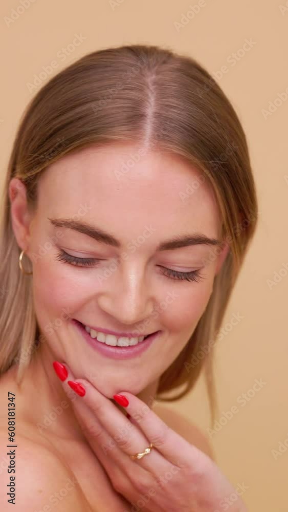 Video of beautiful smiling woman looking in camera on creamy off white beige background with copy space. Video of beautiful smiling woman looking in camera on creamy off white beige background with copy space.