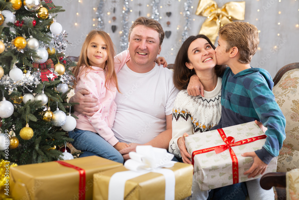 Portrait of a family that is happy with gifts Portrait of a family that is happy with gifts