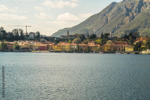 Lake Como from the shore of the city of Lecco. View of the Alps mountains, buildings and the town of Malgrate. 