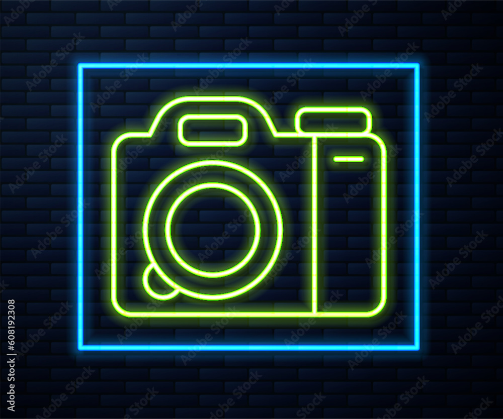 Glowing neon line Photo camera icon isolated on brick wall background. Foto camera. Digital photography. Vector