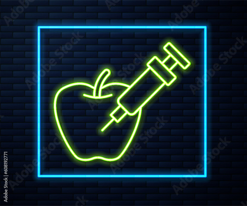 Glowing neon line Genetically modified apple icon isolated on brick wall background. GMO fruit. Syringe being injected to apple. Vector