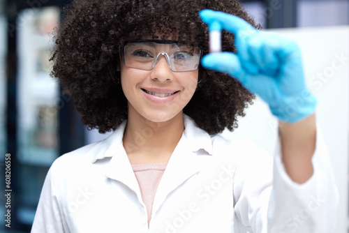 Science, vial and portrait of a female scientist working on research for a project in a lab. Medical innovation, pharmaceutical and woman biology researcher with glasses for discovery in a laboratory