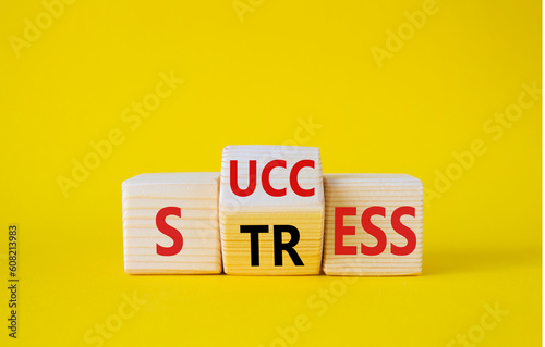 Success vs Stress symbol. Wooden cubes with words Stress and Success. Beautiful yellow background. Success vs Stress and business concept. Copy space