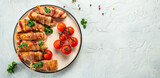 Chicken rolls wrapped in bacon. Delicious balanced food concept. Long banner format. top view