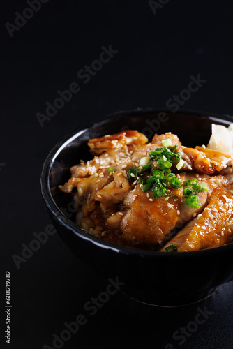 Grilled Chicken teriyaki rice Japanese food isolated in black background