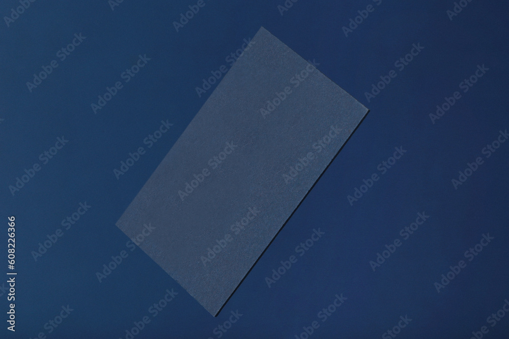 Business cards on blue background. Mockup of stylish business cards. Template for branding identity Business cards on blue background. Mockup of stylish business cards. Template for branding identity