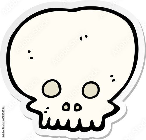 sticker of a cartoon spooky skull symbol