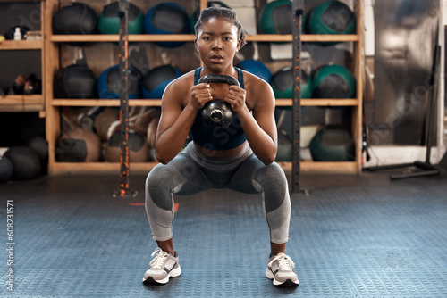 Foto Exercise, fitness and kettlebell with woman squat, workout and gym challenge with weight