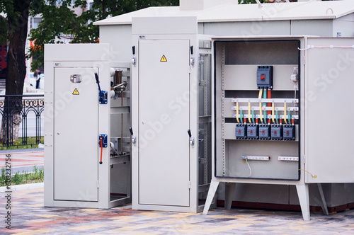 Panels of electrical switches in the open air for inspection at the exhibition. Open cabinet with access to circuit breakers. Power installations of the distribution network of power supply.