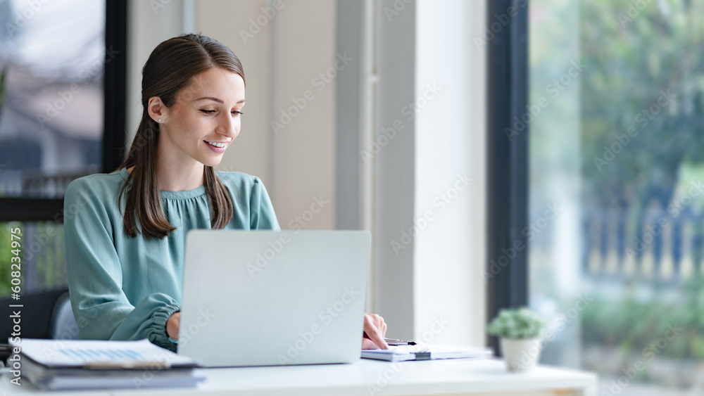 Business analyst calculating turnover figures in office.. Business analyst calculating turnover figures in office..