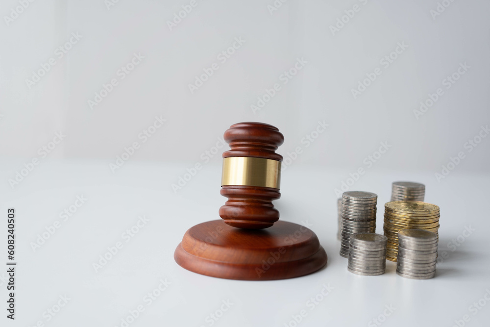Medal pile and old wooden judge hammer Spending planning and investment budget, business money saving ideas, white space copy Medal pile and old wooden judge hammer Spending planning and investment budget, business money saving ideas, white space copy