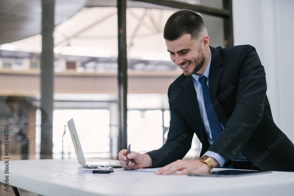 A car dealer businessman signing car insurance document or lease paper. Car loan and Car insurance online concept. A car dealer businessman signing car insurance document or lease paper. Car loan and Car insurance online concept.