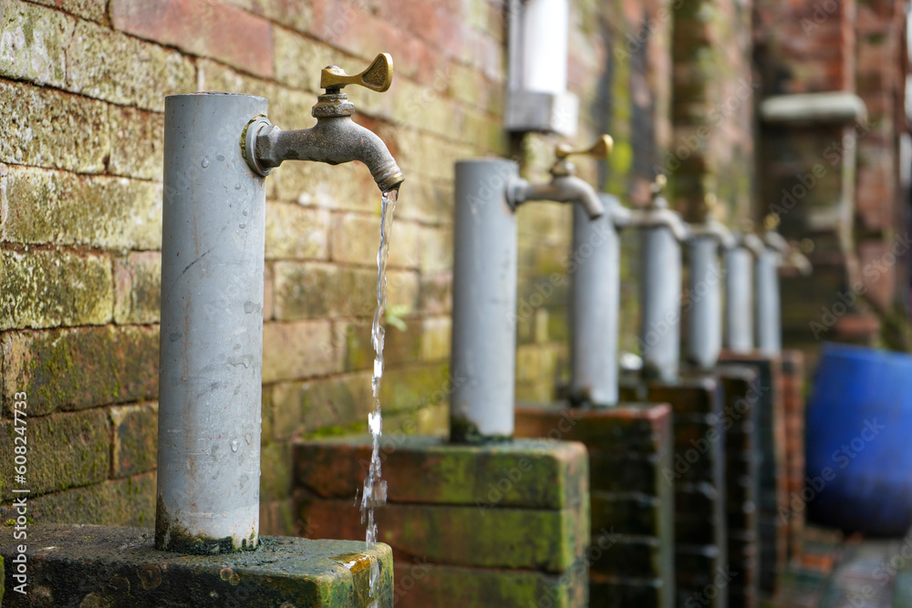 Traditional water taps that are lined up neatly to purify themselves before praying which is often called ablution. Traditional water taps that are lined up neatly to purify themselves before praying which is often called ablution.