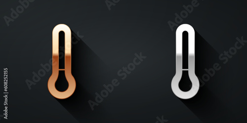 Gold and silver Meteorology thermometer measuring icon isolated on black background. Thermometer equipment showing hot or cold weather. Long shadow style. Vector