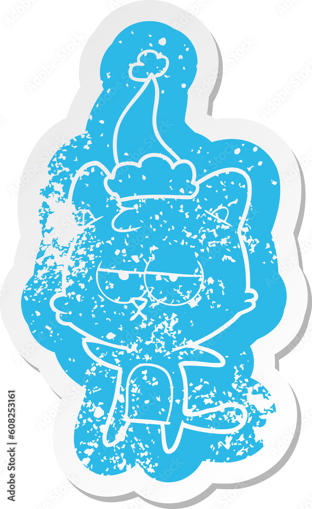 bored quirky cartoon distressed sticker of a cat wearing santa hat