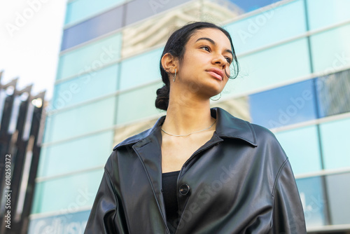 Woman would be next to a glass building