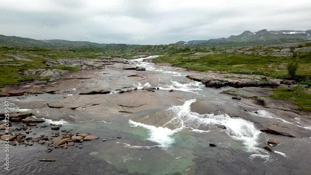 Areal video of a drone flyby over rivers and waterfalls by Hadlaskard, Hardangervidda in Norway. Areal video of a drone flyby over rivers and waterfalls by Hadlaskard, Hardangervidda in Norway.
